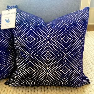 Two square throw pillows by Sag Harbor in deep purple/blue color.